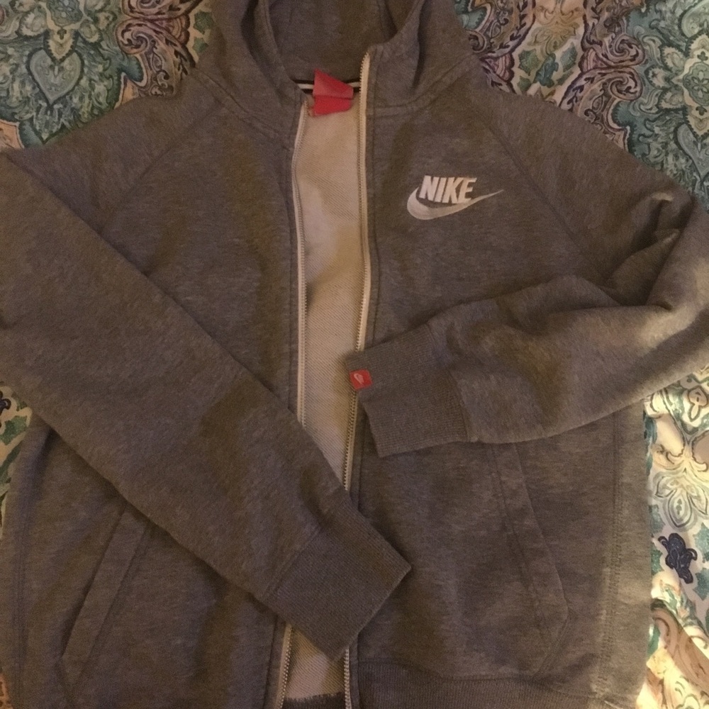 Gray Nike zip up hoodie.